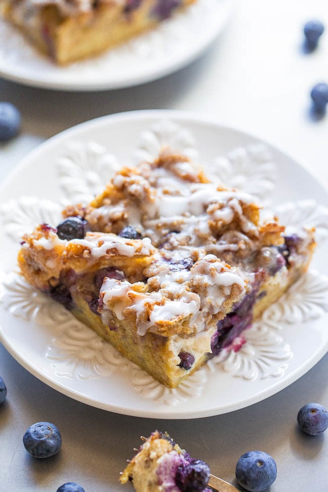 Overnight Blueberry Waffle Breakfast Bars - Blueberry waffles layered with cream cheese, blueberries, streusel, a glaze, and more for one of the BEST breakfasts ever!! It's dessert for breakfast! Assemble it the night before for a mindlessly easy and AMAZING breakfast or brunch!! 