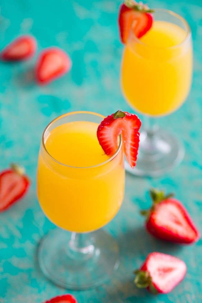 Tropical Mango Mimosas - A fun, easy, and refreshing twist on classic mimosas!! A party favorite at your next brunch or event! Everyone will want REFILLS!!