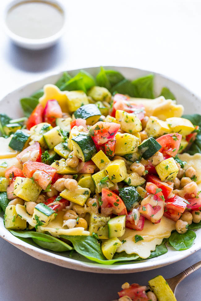 Ravioli and Summer Vegetable Spinach Salad - Crisp-tender zucchini, yellow squash, tomatoes, and chickpeas over spinach with cheesy ravioli and a dijon vinaigrette!! A HEALTHY yet hearty salad that takes advantage of SUMMER!!