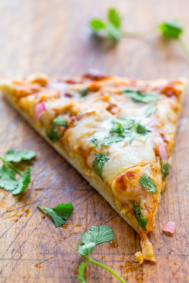 slice of BBQ Pizza with chicken, red onion and cilantro