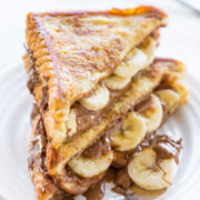 Grilled sandwich with melted chocolate and banana slices.