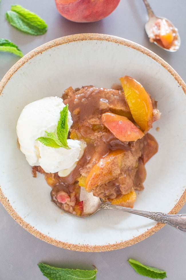 Easy Peach Cobbler (with Fresh Peaches!) — Don't settle for boring peach cobbler when you can have this EASY version that's packed with cinnamon-sugar flavor!! Everything is coated in an AMAZING sauce! Your new GO-TO peach cobbler recipe!!