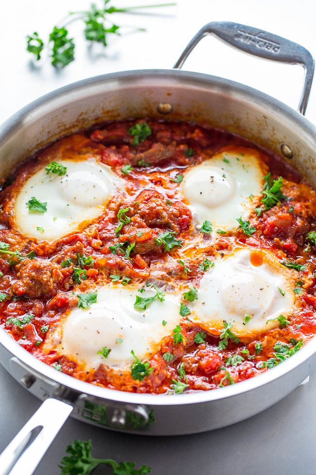 Eggs in Hell with Italian Sausage — Shakshuka (aka Eggs in Hell) is an easy dish made of eggs poached in a spicy tomato sauce.