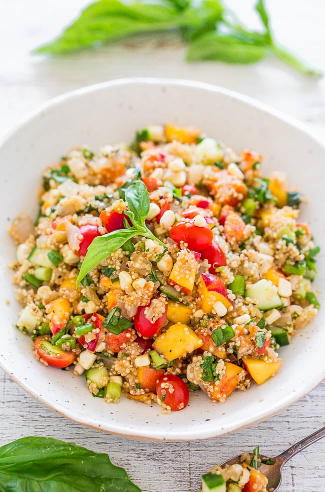Garden Fresh Quinoa Salad - Loaded with everything fresh, light, healthy, and SUMMERY!! Great for parties, potlucks, and lunch boxes because there's no mayo! Make this EASY and flavorful dish before summer disappears!!