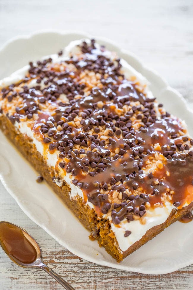 Pumpkin Caramel Poke Cake - Easy and the BEST PUMPKIN CAKE ever!! Two kinds of CARAMEL sauce, TOFFEE bits, CHOCOLATE CHIPS, whipped topping and more!! A total WINNER you must make!!