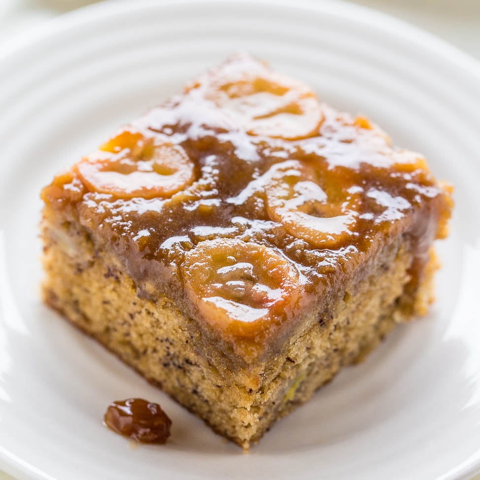 A piece of toffee cake with caramel topping on a white plate.
