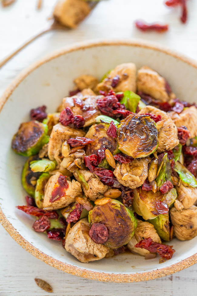 Cranberry Balsamic Chicken Skillet — EASY, hearty, HEALTHY, one-skillet dish that's ready in 20 minutes!! Juicy chicken, crisp-tender Brussels sprouts, chewy cranberries and crunchy pumpkin seeds!