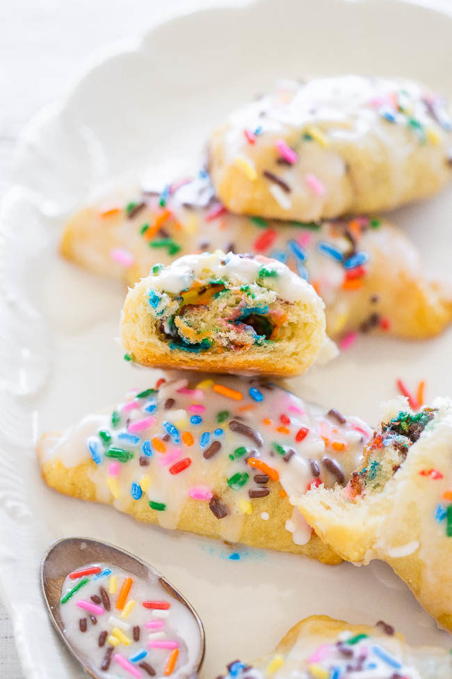 Glazed Funfetti Rolls - Jazz up a tube of crescent rolls with this EASY treat that's ready in 15 minutes!! Soft, buttery, loaded with SPRINKLES and glazed to sweet perfection!!