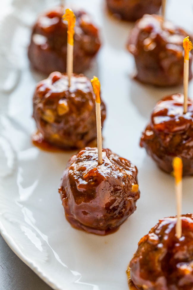 Honey Garlic Meatballs skewered with toothpicks on a white plate 