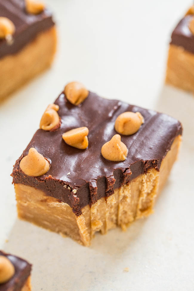 a slice of chocolate peanut butter fudge with a bite missing