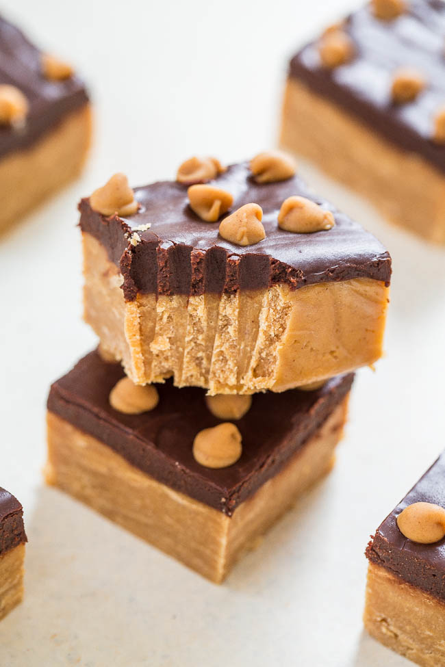 two slices of buckeye fudge stacked on top of each other. The top slice has a bite missing. 