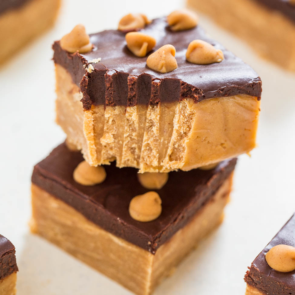 Layered dessert bars with a chocolate topping and peanut butter chips.