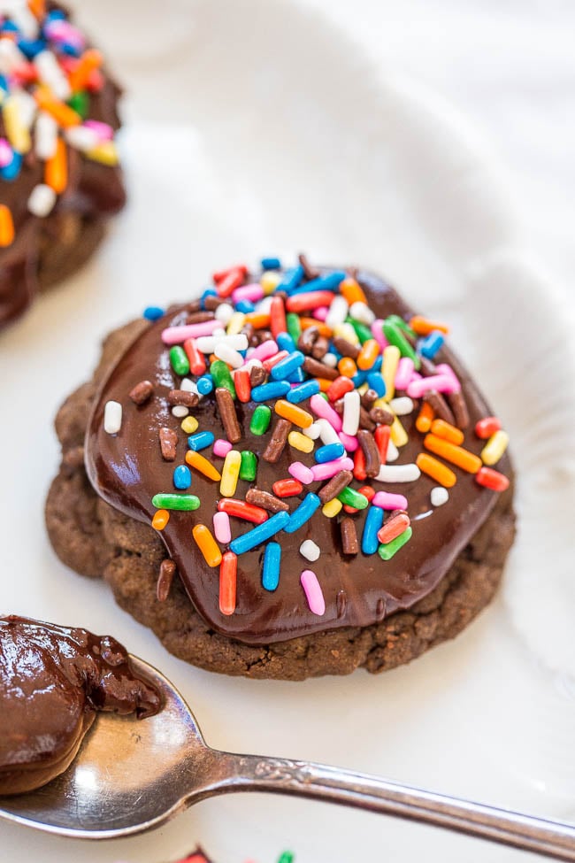 Frosted Triple Chocolate Cookies — A chocaholic's DREAM! Soft chocolate cookies with chocolate chips, cocoa, and topped with fudgy chocolate ganache!! Rich, decadent, and heavenly!!