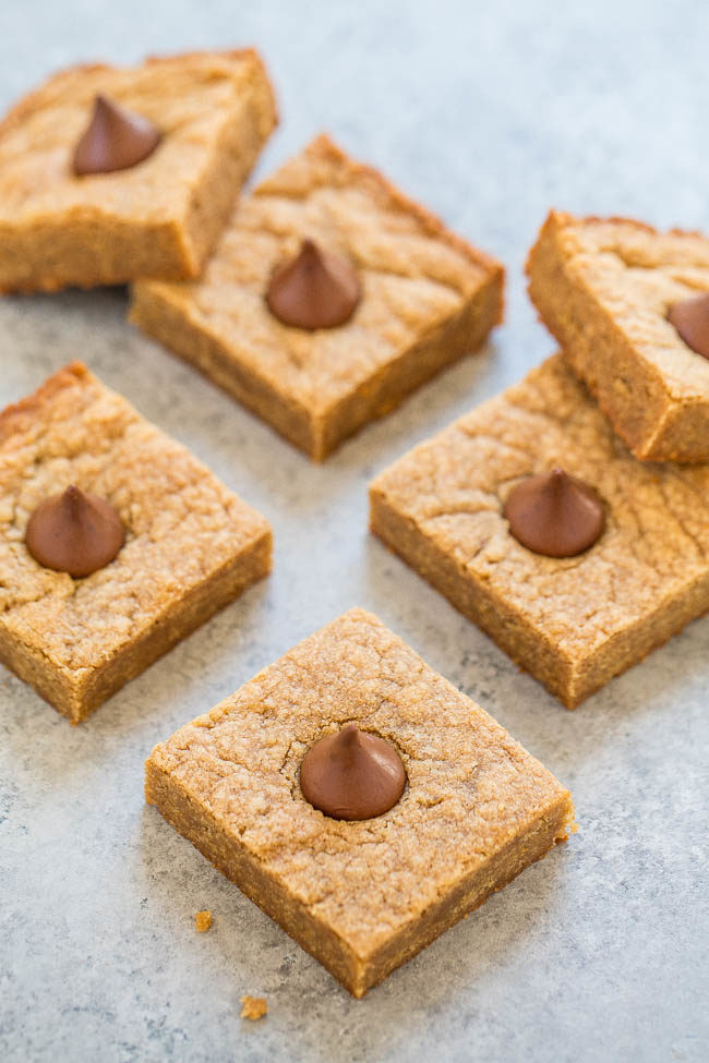 Peanut Butter Blossom Cookie Bars - Like the classic cookies except much FASTER and EASIER to make!! One bowl and no mixer! Soft and chewy with rich peanut butter flavor and each piece is topped with a Kiss!!