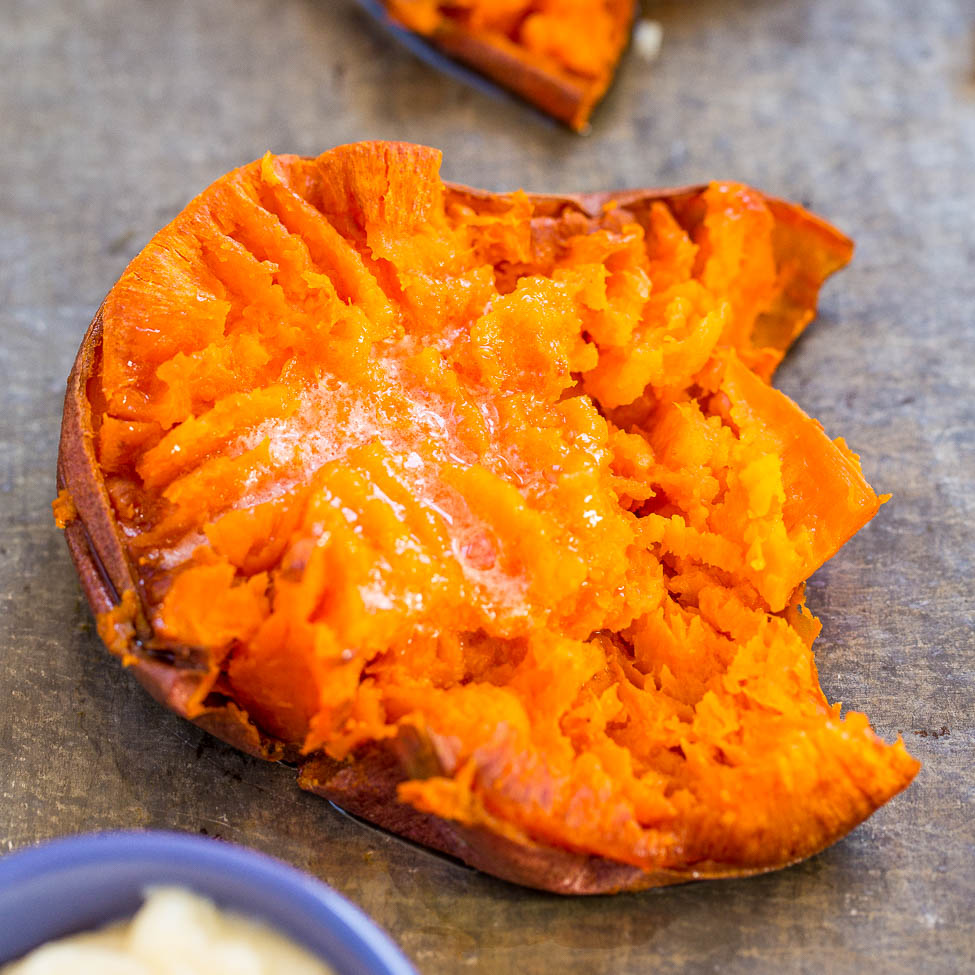 A baked sweet potato with a softened, flaky texture and a sprinkle of salt on top.