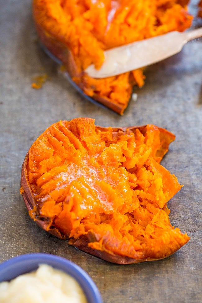 two smashed sweet potatoes topped with honey butter 