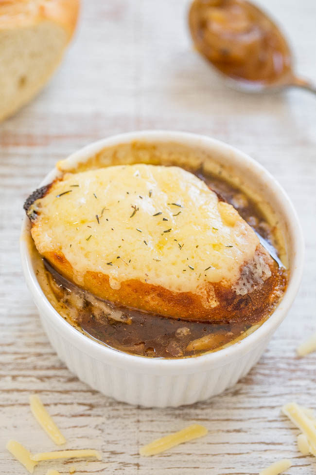 Easy One-Hour French Onion Soup - Learn how to make the classic soup in 1 hour and it's EASY! Full of rich, savory flavor and topped with French bread and melted cheese that's IRRESISTIBLE!!