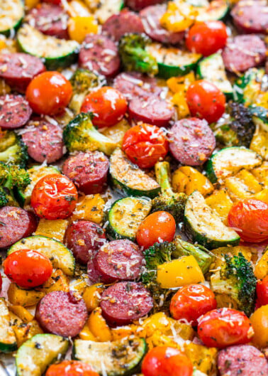 A colorful roasted vegetable and sausage sheet pan meal.