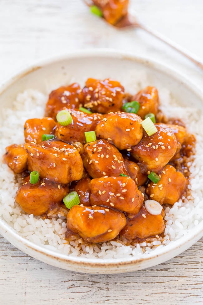 easy sweet and sour chicken on a white plate with white rice