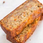 Two stacked slices of carrot banana bread.