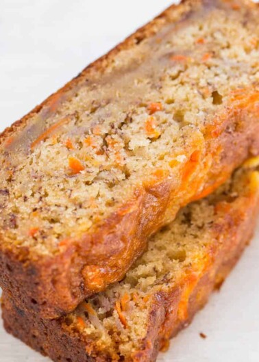 A close-up of a moist slice of carrot cake bread.