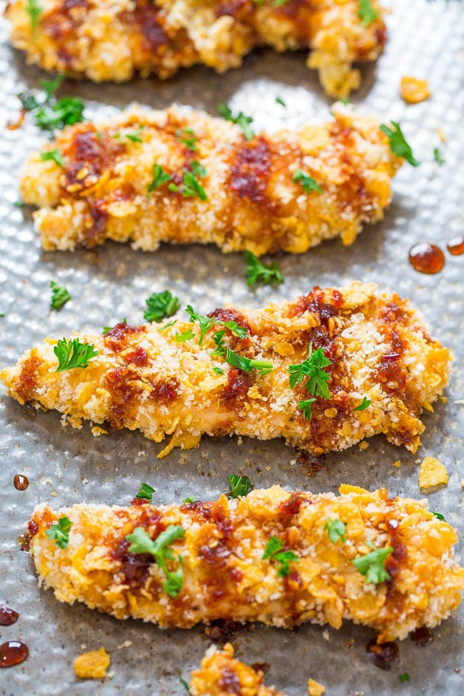 Kicked Up Cornflake Chicken - EASY, ready in 30 minutes, so CRISPY on the outside and tender and juicy inside!! The sauce has the perfect amount of KICK to keep you going back for more!!