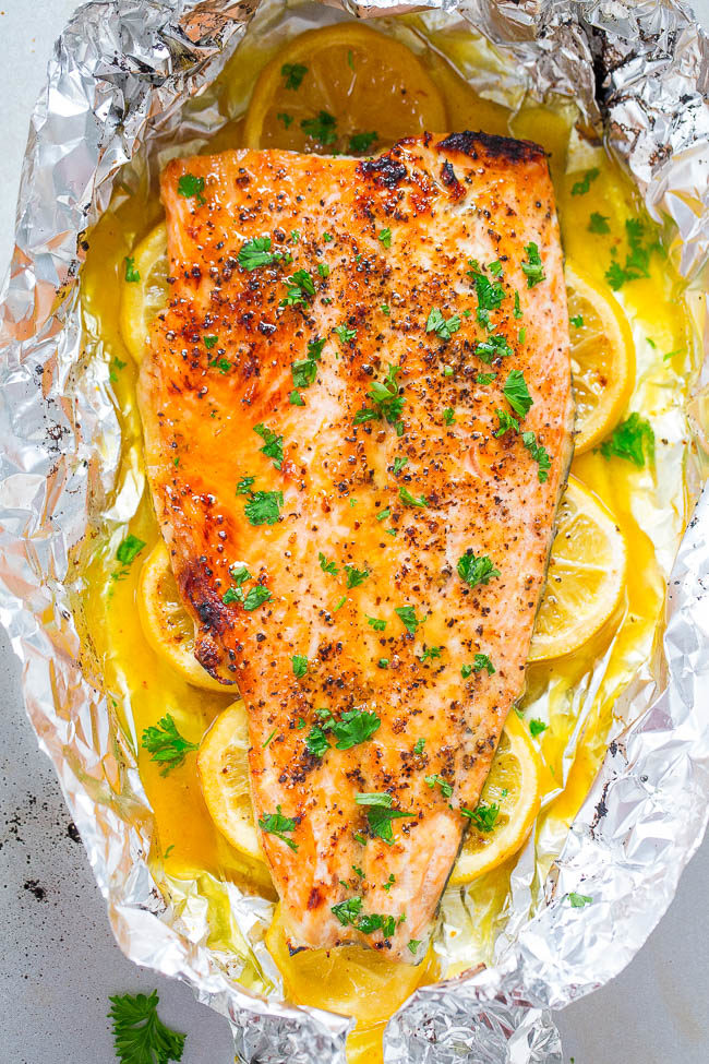 Sheet Pan Honey Lemon Salmon - Make salmon at home in 30 minutes that tastes BETTER than from a restaurant!! EASY, tender, and packed with FLAVOR from the honey and lemon butter!!
