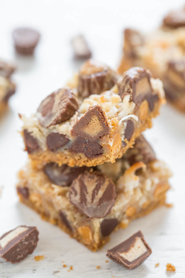 Peanut Butter Seven Layer Bars - There's peanut butter, peanut butter chips AND peanut butter cups in this fun twist on the classic recipe!! EASY no-mixer recipe that peanut butter fans will LOVE!!