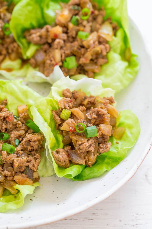 close up of asian lettuce wraps on a white plate 
