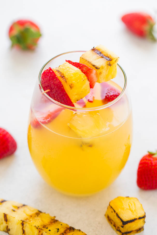 Grilled Strawberry Pineapple Sangria — EASY, light, refreshing, and perfect for your next warm weather PARTY!! Grilling brings out pineapple's natural sweetness and it's DELISH!!