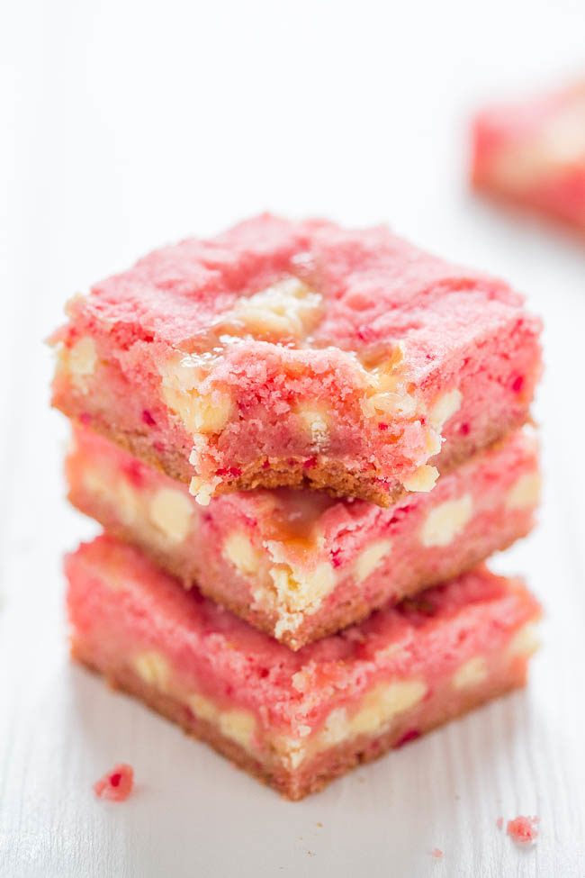 A stack of Strawberry White Chocolate Gooey Bars on a white table