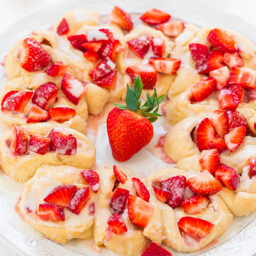 A plate of freshly glazed strawberry pastries.