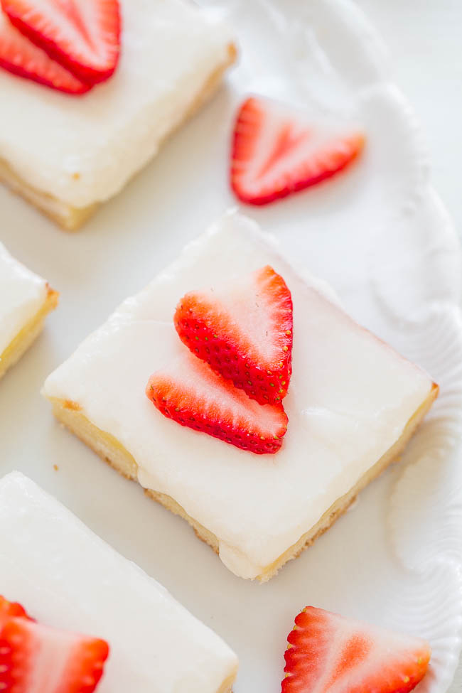 close up of Strawberry Shortbread Bars on white platter