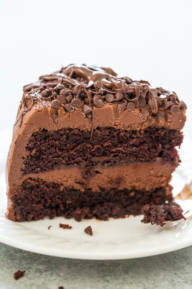 The Best Triple Chocolate Layer Cake - Rich, intense, and everything you crave in DECADENT chocolate cake!! Along with tender chocolate cake there's chocolate cream cheese frosting, chocolate chips, and melted chocolate!!