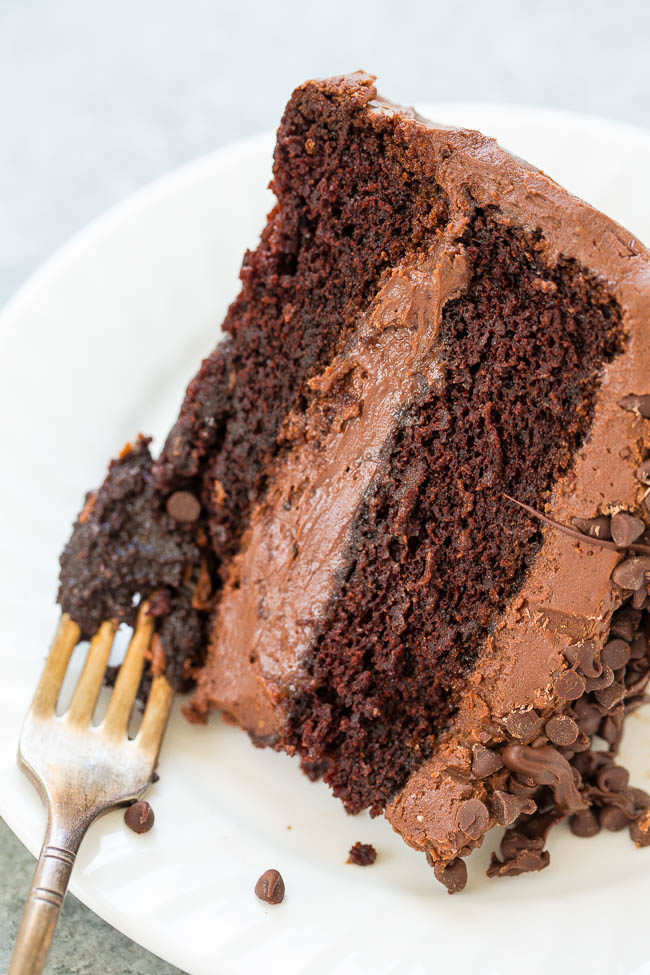 The Best Triple Chocolate Layer Cake - Rich, intense, and everything you crave in DECADENT chocolate cake!! Along with tender chocolate cake there's chocolate cream cheese frosting, chocolate chips, and melted chocolate!!