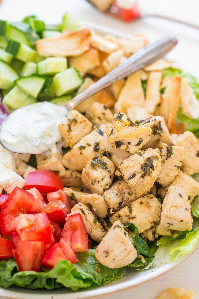 Chicken Gyro Salad with Tzatziki Sauce - Chicken gyros transformed into a HEALTHY salad with an EASY homemade tzatziki sauce that's loaded with tangy dill FLAVOR!! Ready in 20 minutes!!