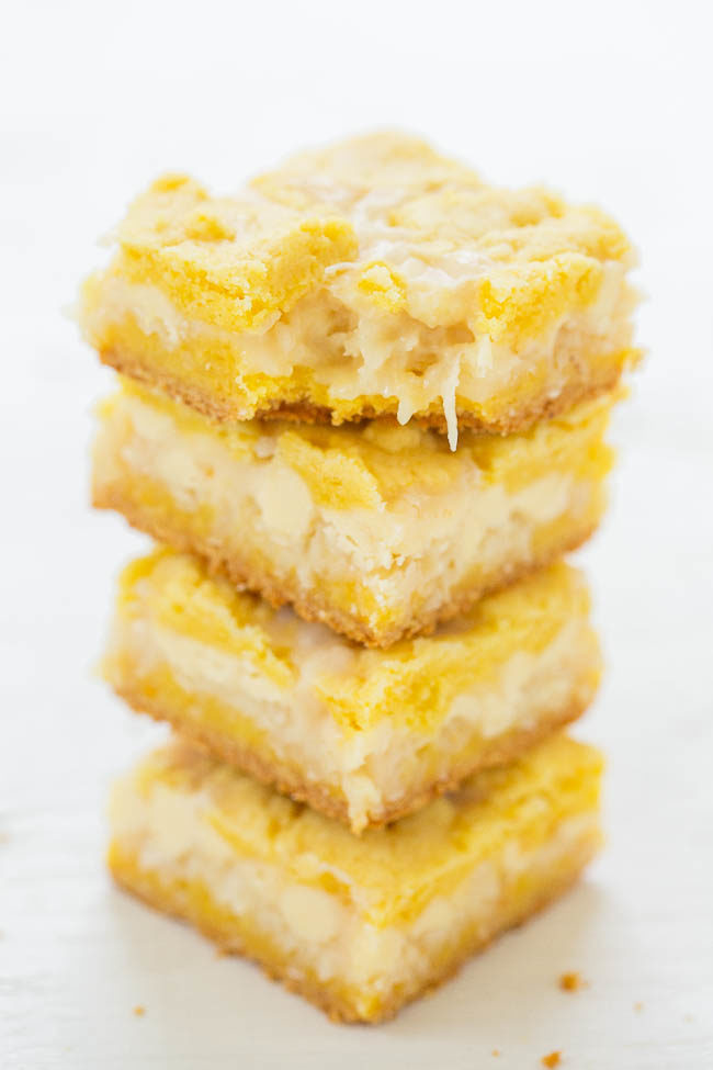 Lemon Coconut White Chocolate Gooey Bars - If you like traditional lemon bars, you'll LOVE this EASY recipe for soft, chewy, and oh-so-gooey lemon bars!! Loaded with white chocolate and coconut!!