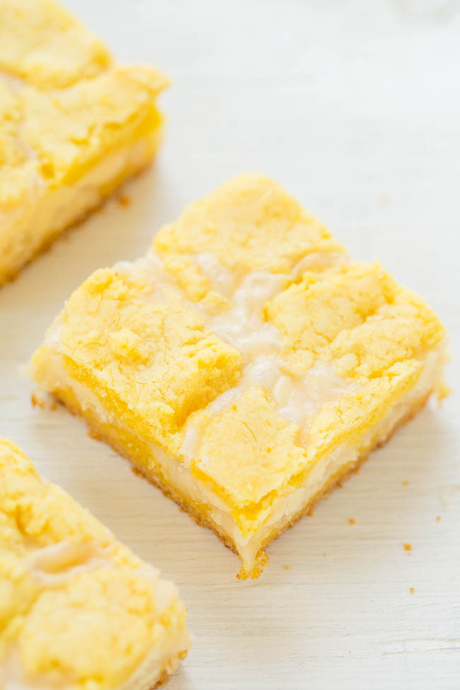 Gooey Lemon Coconut Bars — If you like traditional lemon bars, you'll LOVE this EASY recipe for soft, chewy, and oh-so-gooey lemon bars!! Loaded with white chocolate and coconut!!