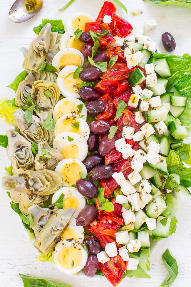 Mediterranean Cobb Salad - An EASY, HEALTHY, Mediterranean twist on classic Cobb salad that's ready in 10 minutes!! Artichokes, olives, peppers, cucumbers, feta, and more! The vinaigrette is light yet flavorful and DELISH!!