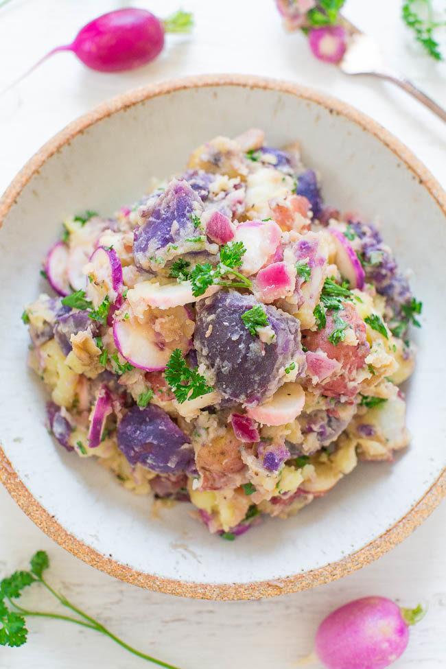 Overhead shot of Pink and Purple Potato Salad in a white bowl