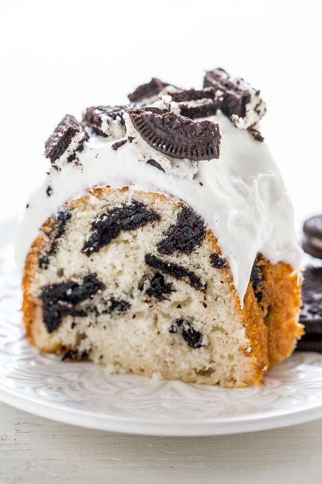 Cookies and Cream Bundt Cake - Extremely EASY white cake that's LOADED with Oreos, decadent vanilla frosting, and sprinkled with MORE Oreos!! A partytime favorite!!