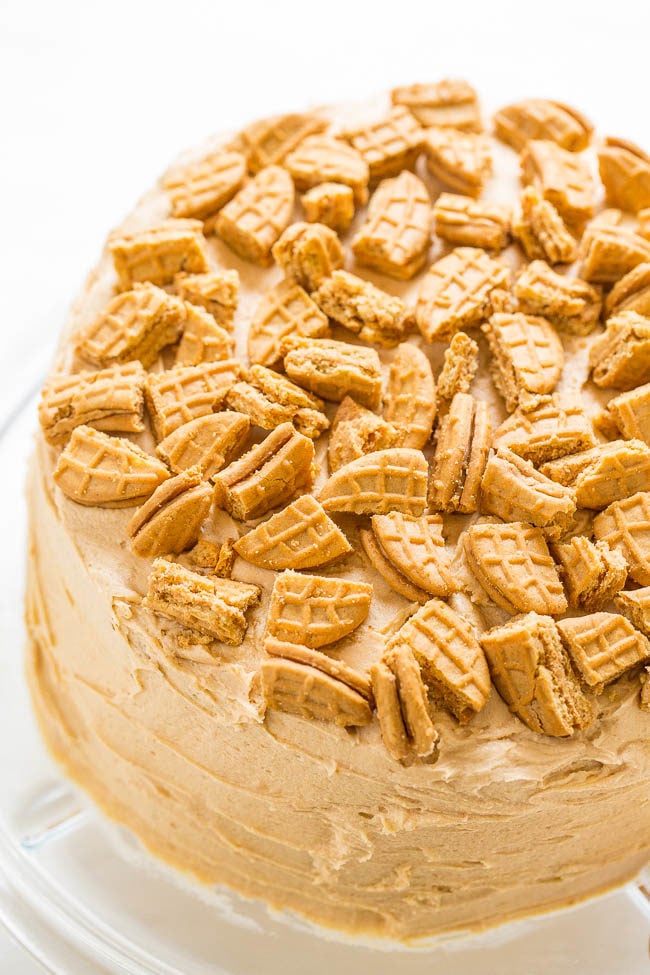 Nutter Butter Peanut Butter Layer Cake - Soft yellow cake with Nutter Butters baked in AND sprinkled on top!! The peanut butter FROSTING is rich, creamy, and decadent! Peanut butter fans will LOVE this cake!!