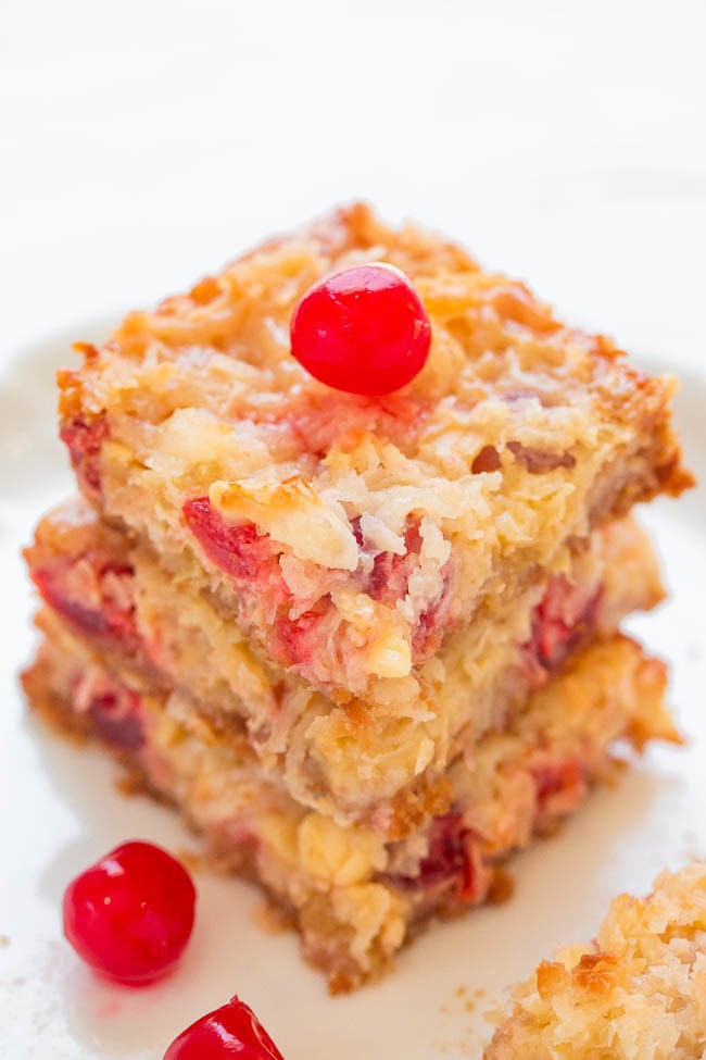 Pina Colada Seven Layer Bars - Eat your pina colada rather than drinking one with these fast, EASY, no-mixer bars that taste TROPICAL!! Pineapple, coconut, white chocolate, and cherries!!