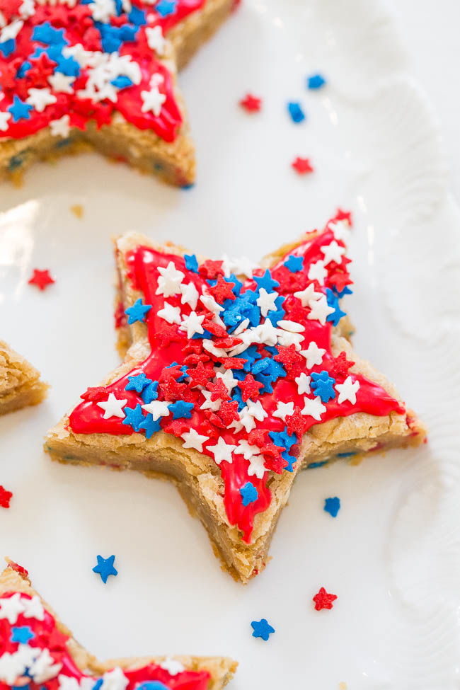 Red, White, and Blue Star Cookies - Get patriotic with these SOFT, chewy, frosted star cookies that are loaded with SPRINKLES!! No rolling pin required! They're a holiday WINNER!!