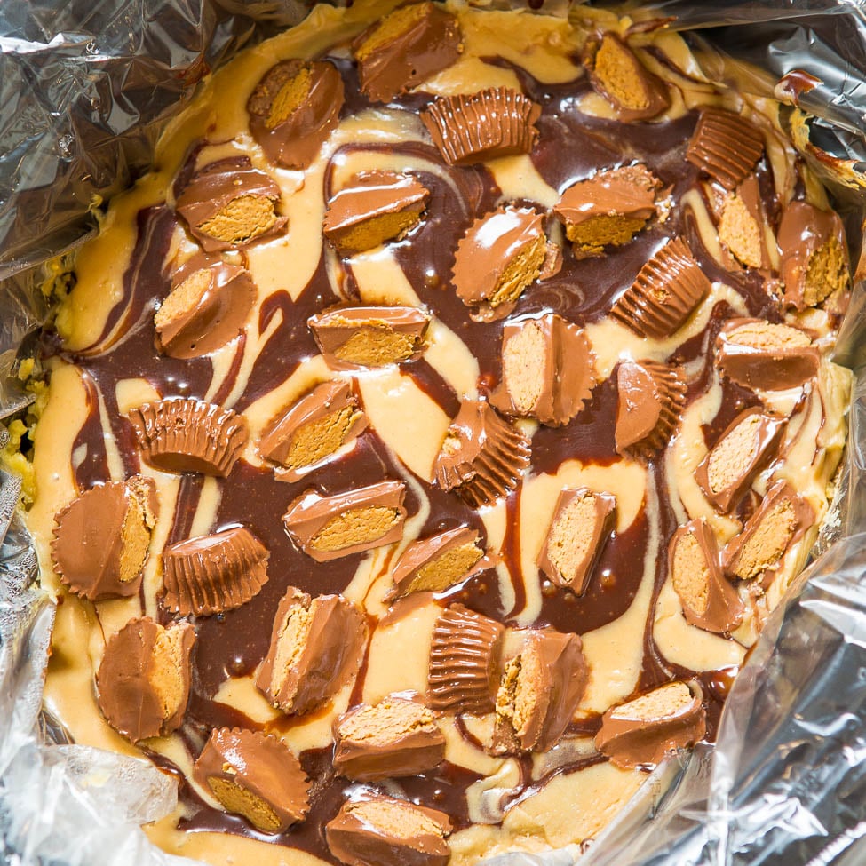 A homemade dessert with peanut butter cups and chocolate drizzle.