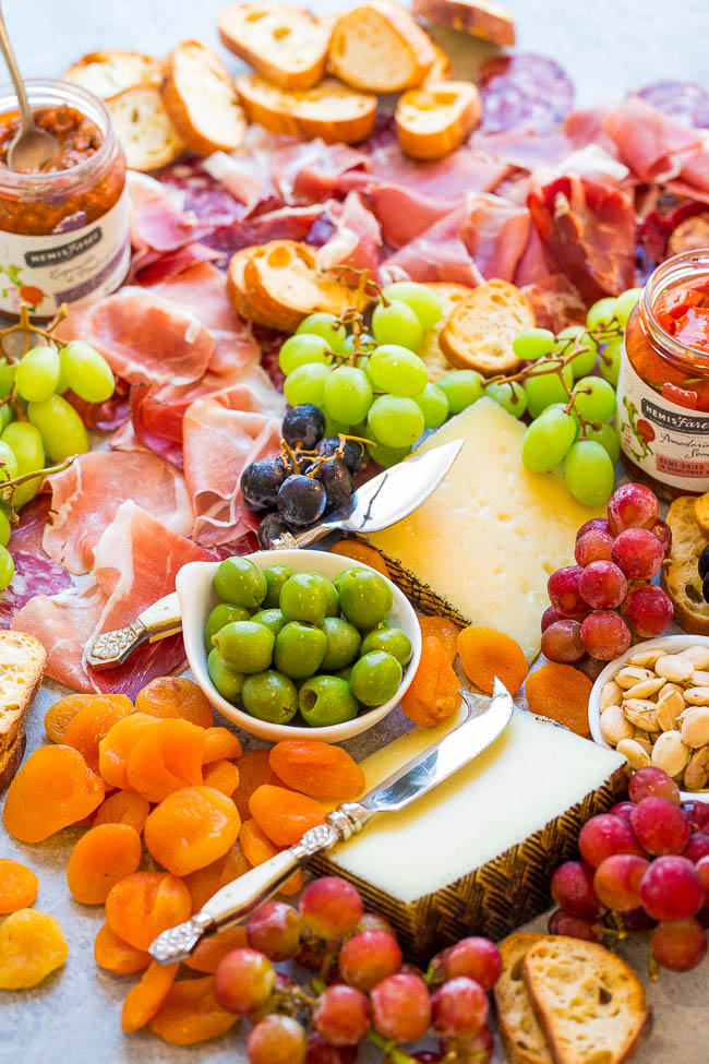 Easy Spanish Cheese Board — Learn my TIPS and tricks to create the PERFECT cheese board!! From prosciutto to manchego and everything in between, this Spanish appetizer board has ALL the goodies! It'll be a major hit at your next party!!