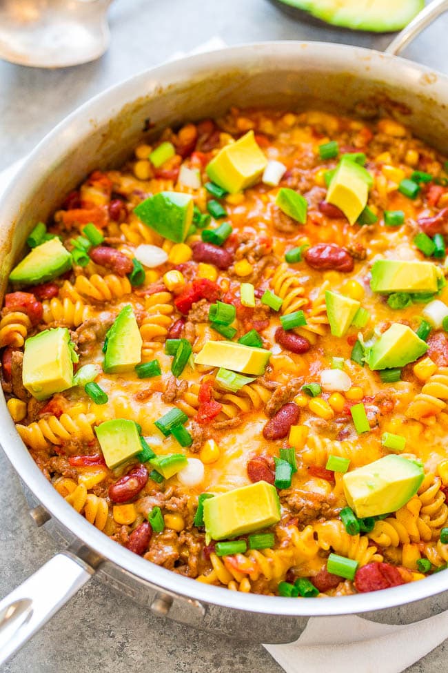 One Skillet Beef Taco Pasta - An EASY recipe that's ready in 20 minutes, made in ONE skillet, and loaded with Mexican-inspired flavors!! A family favorite that's great for busy weeknights!!