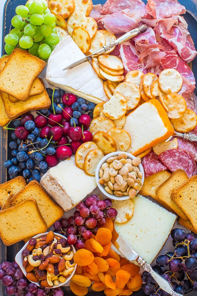 How To Make The Best Cheese Board - Learn my TIPS and tricks to create the BEST cheese board!! From brie to prosciutto and everything in between, this board has it ALL! It'll be a major hit at your next party!!