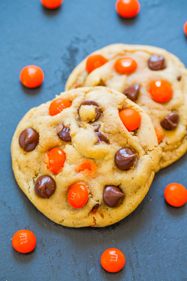 two Chocolate Chip M&M's Halloween Cookies on blue countertop