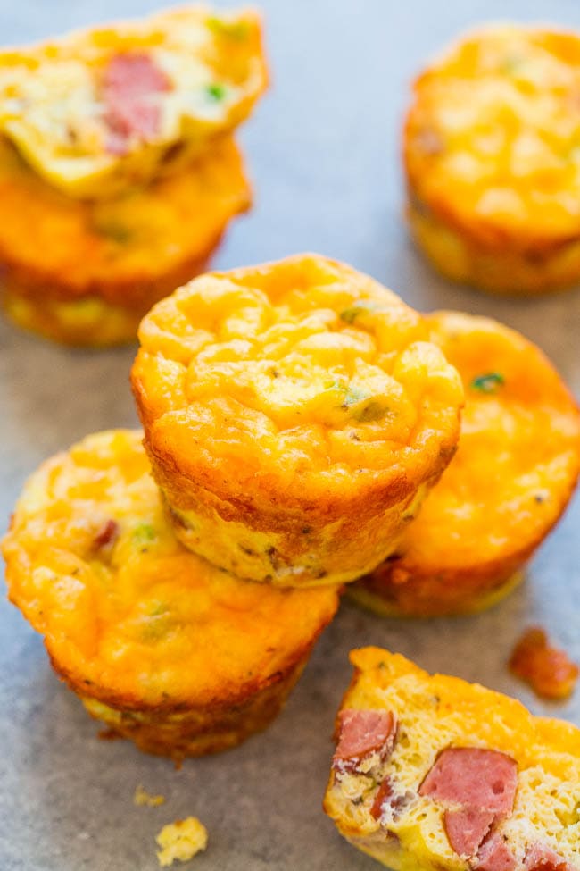 100-Calorie Cheesy Sausage and Egg Muffins - Low carb baked egg muffins that are loaded with juicy sausage and cheese! EASY, ready in 30 minutes, and perfect for breakfast, brunches, snacks, or breakfast-for-dinner! You'll want to keep a stash on hand!!